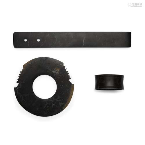 A large black jade blade; a black jade bracelet; and a black...