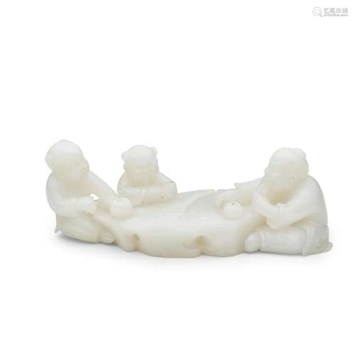 A white jade carving depicting figure playing weiqi