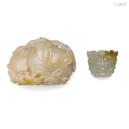 A cream jade 'double-peach' carving and a white jade tiger-h...