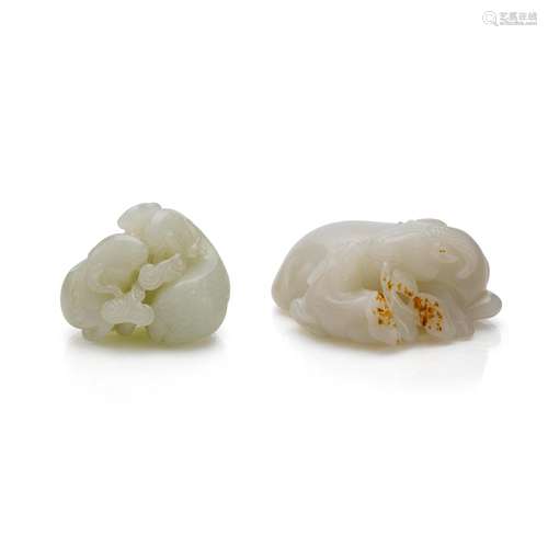 A small white jade 'two-rams' group and a white and russet j...