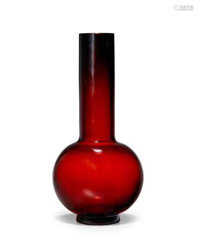 A deep strawberry-red globular glass vase with tall neck