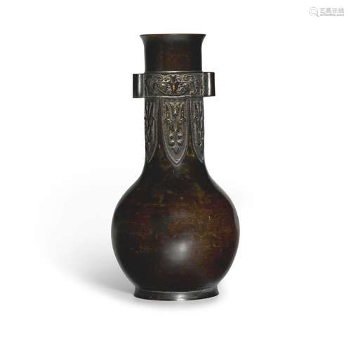 An archaistic silver-inlaid patinated bronze bottle vase