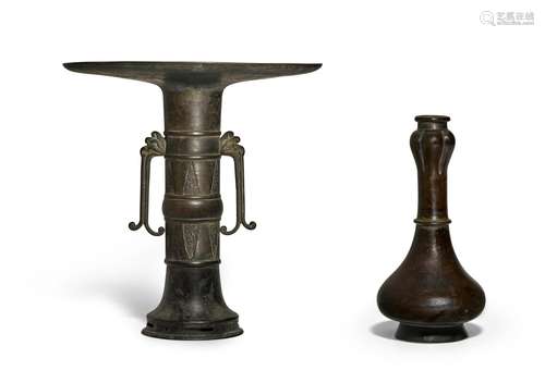 A garlic-mouthed pear-shaped bronze vase and a flat-rimmed c...