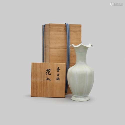 A celadon-glazed vase