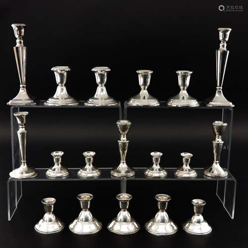 A Collection of 18 Silver Candlesticks