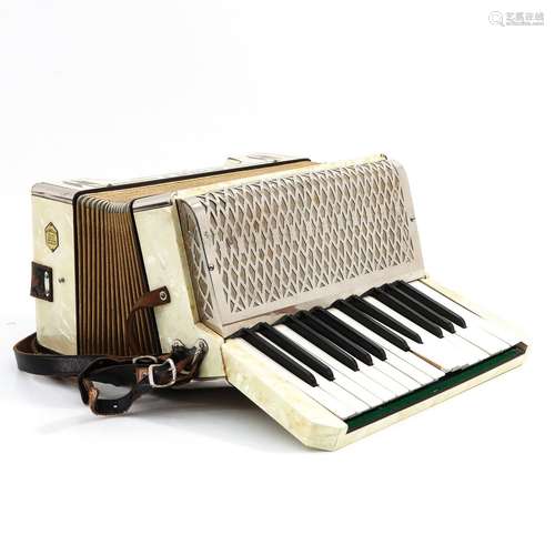 A Hohner Accordeon with Case