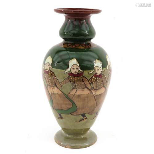 A Dutch Pottery Vase Depicting Volendam Girls