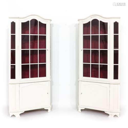 A Pair of White Painted Corner Cabinets