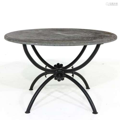 An Iron Base Garden Table with Slate Top