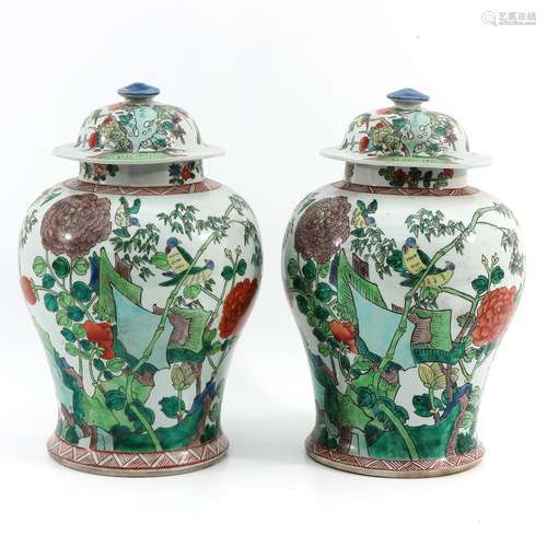 A Pair of Famille Verte Jars with Covers