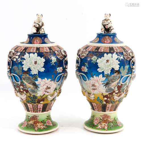 A Pair of Vases with Covers