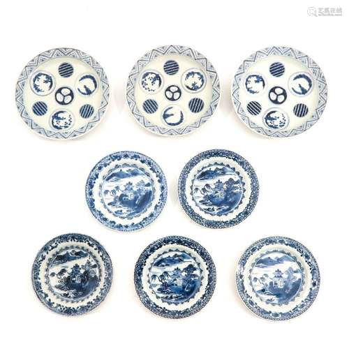 A Collection of 8 Blue and White Plates