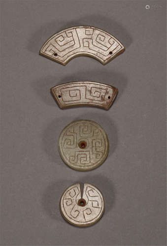 A HAN DYNASTY STYLE SET OF FOUR JADE ACCESSARIES