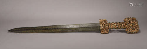 A WARRING STATE PERIOD STYLE GILT BRONZE SWORD
