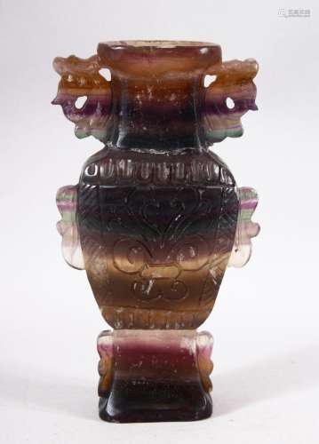 A CHINESE CARVED AMETHYST STONE VASE - Carved in the form of...