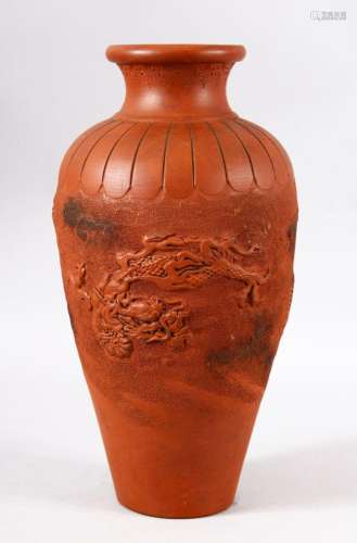 A CHINESE YIXING CLAY MOULDED VASE - The body decorated with...