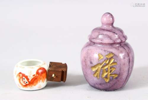 A CHINESE CARVED AMETHYST CALLIGRAPHIC OBJECT & IRON RED...