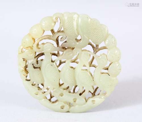 A CHINESE CARVED JADE DISK // PENDANT - Carved with birds as...