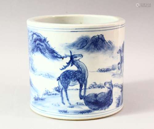 A LARGE CHINESE BLUE AND WHITE BRUSH POT, decorated with dee...