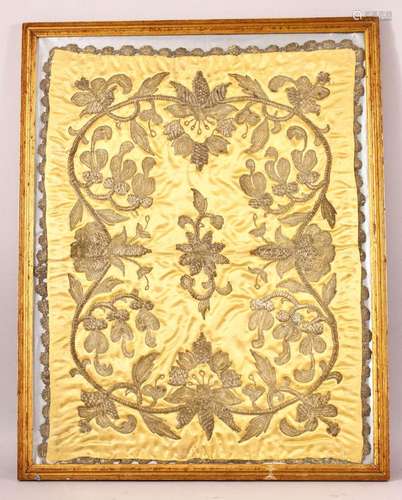 A CHINESE EMBROIDERED FRAMED TEXTILE - upon a mustard yellow...