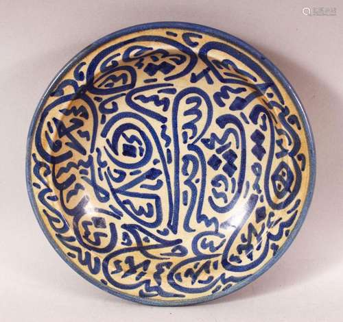 AN ISLAMIC CIRCULAR POTTERY BOWL, painted with stylised call...