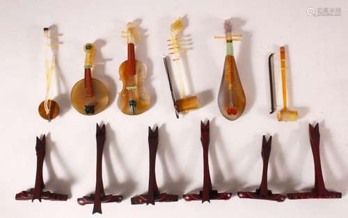 A GROUP OF SIX CHINESE MINIATURE HARD STONE MODELS OF MUSICA...