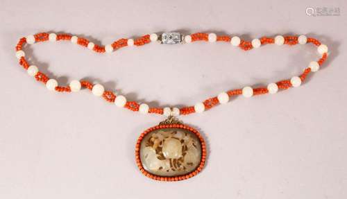 A CHINESE JADE AND CORAL PENDANT AND CHAIN, the pendant with...