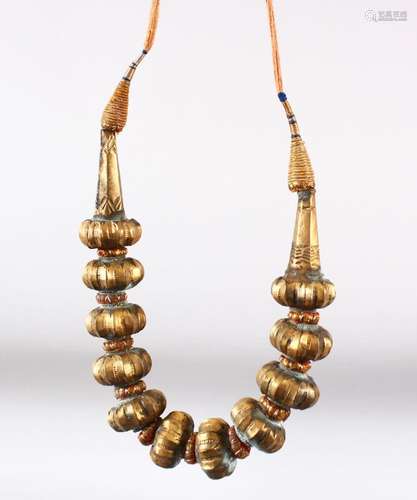 AN ISLAMIC GILDED SOFT METAL NECKLACE.