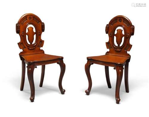 A pair of Victorian mahogany hall chairs, c.1860, cartouche ...