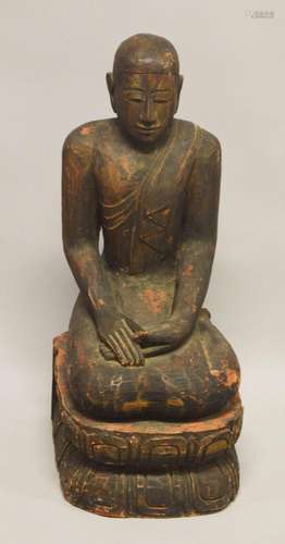 A LARGE AND HEAVY CARVED WOOD FIGURE OF BUDDHA, 79cm high.