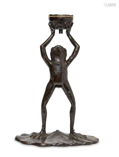 A modern bronze model of a standing frog, with arms aloft su...