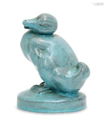 A German turquoise glazed terracotta model of a duck, signed...