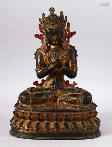 A TIBETAN GILT COPPER FIGURE OF YOGIMI / BUDDHA - in a seate...