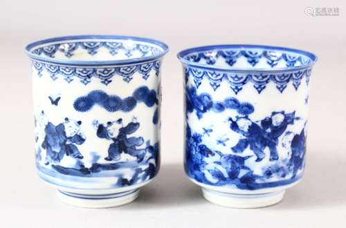 A NEAR PAIR OF JAPANESE BLUE AND WHITE PORCELAIN CUPS, decor...