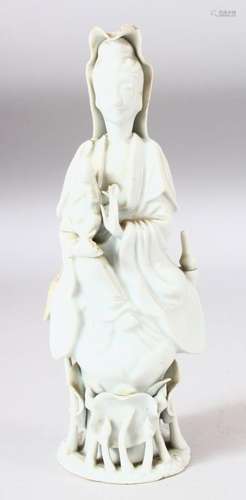 A CHINESE BLANC DE CHINE PORCELAIN FIGURE of guanyin upon lo...