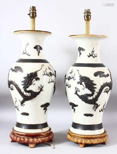 PAIR OF CHINESE CRACKLE GLAZE PORCELAIN LAMP VASES, on fitte...