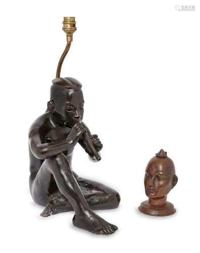 A modern bronze electrotype lamp in the form of a seated mal...