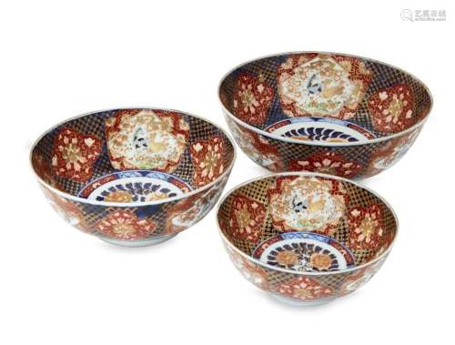 Three Japanese Imari graduated bowls, 20th century, the inte...
