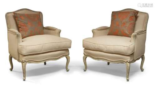 A pair of a French Louis XV style upholstered cream upholste...