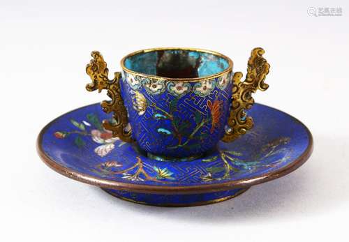 A CHINESE CLOISONNE TWIN HANDLE CUP AND SAUCER, decorated wi...