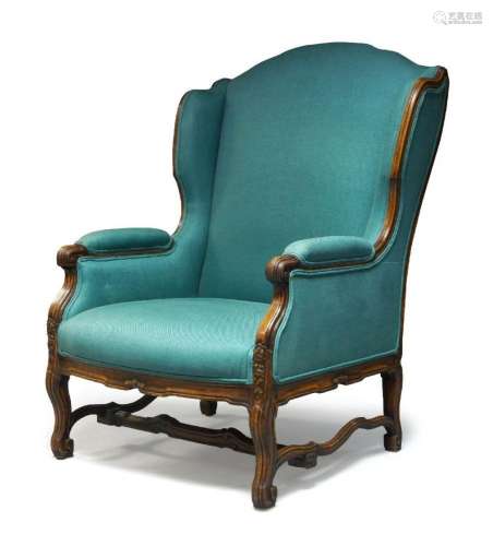 A blue upholstered wing back armchair, late 19th/early 20th ...