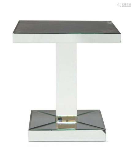 A modern mirrored pedestal side table, the square top raised...