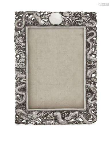 A Chinese export silver photograph frame, the pierced border...