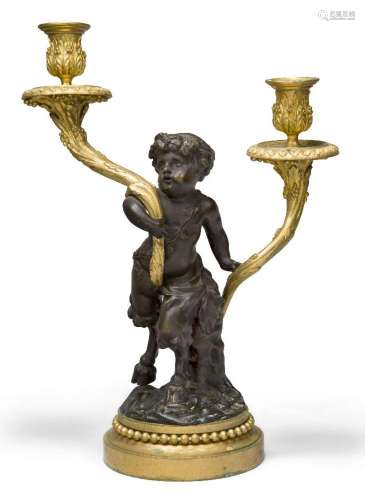 A French gilt and patinated bronze twin-light candelabrum, l...