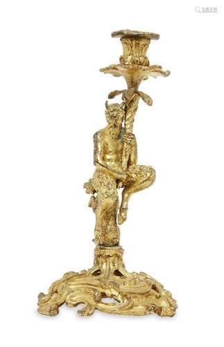 A French gilt-bronze candlestick, late 19th century, modelle...