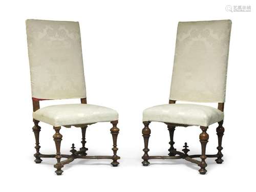 A pair of Italian walnut high backed chairs, probably Liguri...