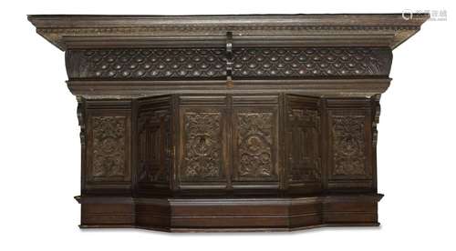 A Victorian Jacobean style oak fire surround, incorporating ...