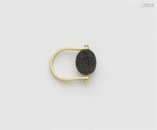 A 14k gold twisting ring with an ancient Phoenician scarab a...