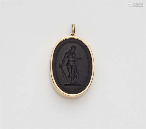 An 18k gold pendant with a paste intaglio