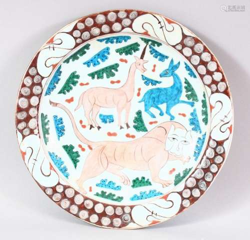 A GOOD LARGE IZNIK POTTERY DISH - decorated in an array of c...